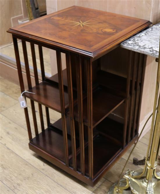 A reproduction walnut revolving bookcase W.50cm